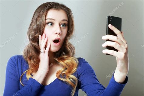 Shocked Woman Look At Phone Stock Photo By ©lenanet 119683698