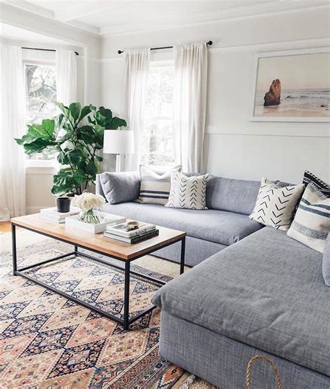 This lovely vancouver living room layered in blues and brass, designed by gillian segal. living room - cozy couch, patterned carpet, minimalist ...