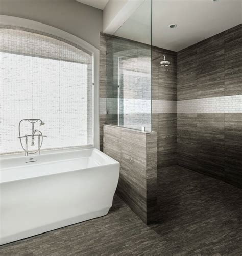 Nice bathroom with natural stone tiles and wood cabinet. Your Complete Guide to Bathroom Tile | Why Tile®