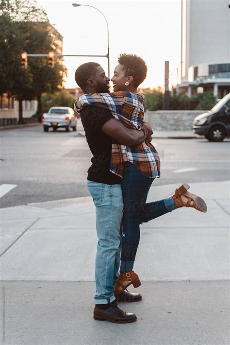 A Young Black Couple Walking Around The City At Sunset Del