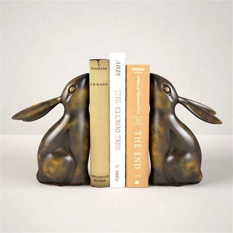 A Bookend With Two Books In The Shape Of Rabbits