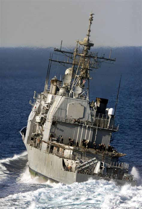 ticonderoga class guided missile cruiser uss normandy cg 60 leans starboard as it executes a