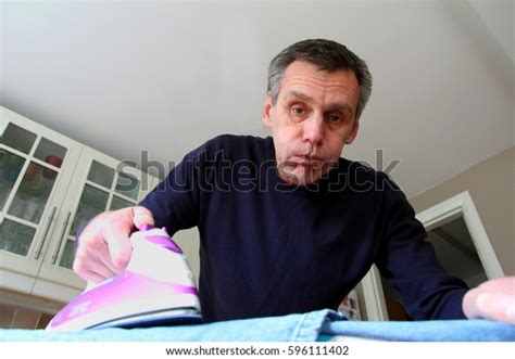 Mature Man Struggles Ironing Laundry Stock Photo Shutterstock