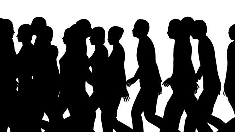 Silhouettes Of People Walking Together In A Line