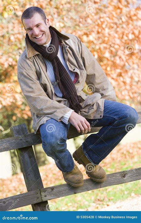 Young Man Sitting On Fence Royalty Free Stock Photos Image 5305428