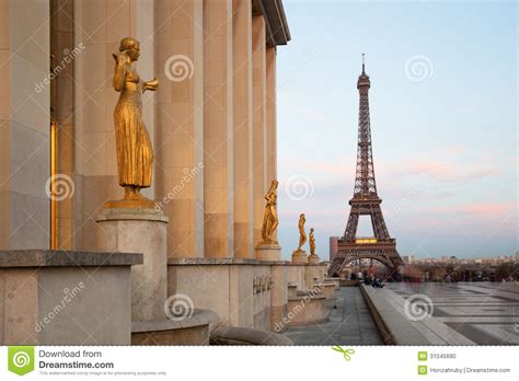 View Of The Eiffel Tower With Sculptures On Trocadero In