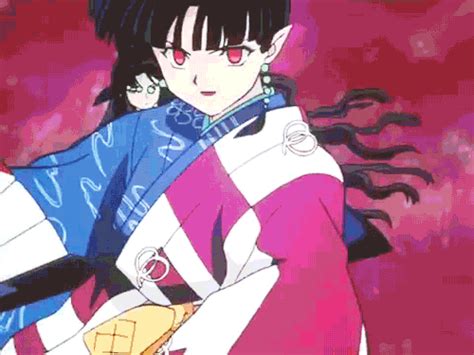 An Anime Character With Long Black Hair And Red Eyes Wearing A Blue Kimono