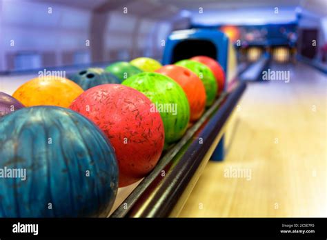 Bowling With Colorful Bowling Balls In Return Machine Stock Photo Alamy