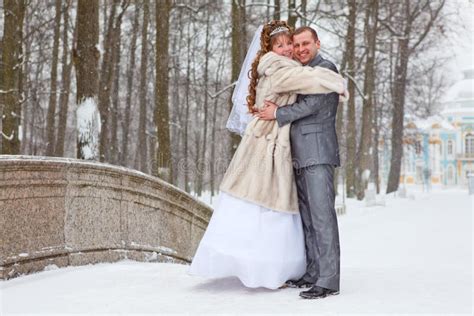 Embracing Newly Wedding Couple In Winter Season Stock Photo Image Of