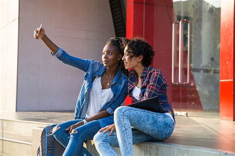 Girlfriends Taking A Selfie In Campus By Stocksy Contributor Jovo Jovanovic Stocksy