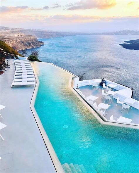 An Outdoor Swimming Pool Next To The Ocean