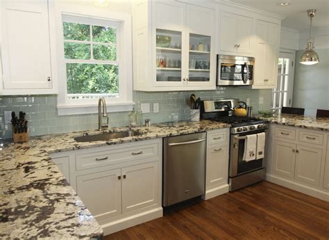 Browse our popular backsplash tiles today! Such a happy and inviting kitchen! The blue glass subway ...