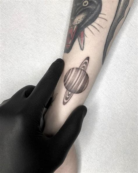 Saturn Tattoo Located On The Wrist Dotwork Style
