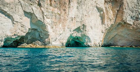 Greece Zakynthos August 2016 Rocks Caves And Blue Water Stock Photo