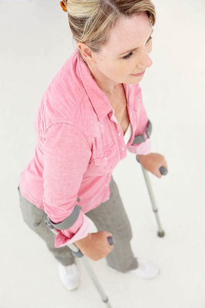 440 Mature Woman Crutches Stock Photos Pictures And Royalty Free Images