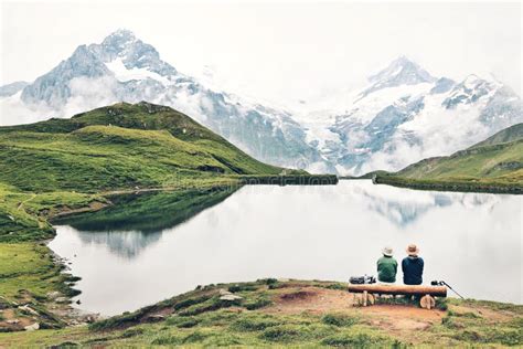 Romantic Couple On A Bench By The Mountain Lake Stock Photo Image Of