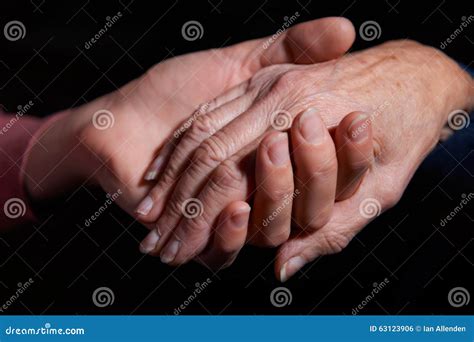 Young Woman Holding Older Woman S Hand Stock Photo Image Of Holds