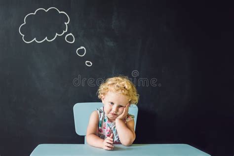 Closeup Portrait Of Cute Little Girl Thinking Deeply About Something