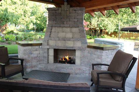 The chunky black mexican beach pebbles surrounding the flames are easily found at your local home improvement store. Warmth And Comfort Outdoor Chimney Fire Pit — Rickyhil ...