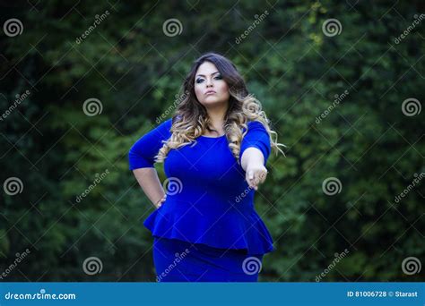 Young Beautiful Plus Size Model In Blue Dress Outdoors Xxl Woman On