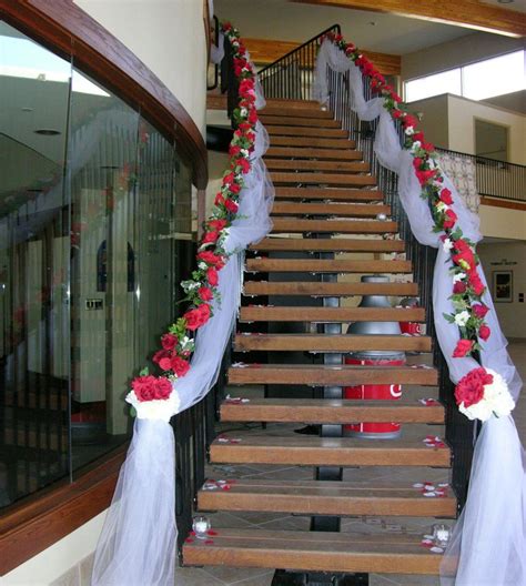 Stairway Decorated With White Tulle And Red Silk Roses Wedding