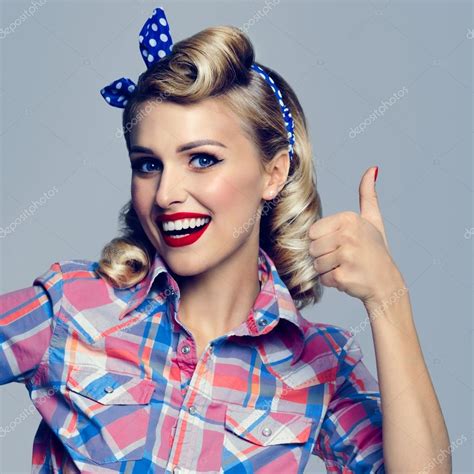 Smiling Woman Showing Thumb Up Gesture Dressed In Pin Up Style Stock
