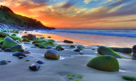 Sunset Ocean Sandy Beach Rocks Green Movi Water Nature 4k Wallpaper For