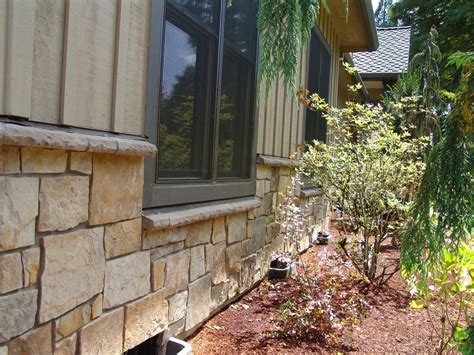 Window sills serve to structurally support and hold the window in place. natural stone veneer, stone around windows, stone cap, new ...