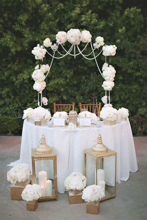 Plant the spotlight firmly on your sweetheart table by illuminating it with a few extra lights. Sweetheart Table Inspiration | Sweetheart table, Sweetheart table decor, Wedding table decorations