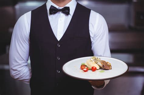 Handsome Waiter Holding A Plate Stock Photo Download Image Now Istock