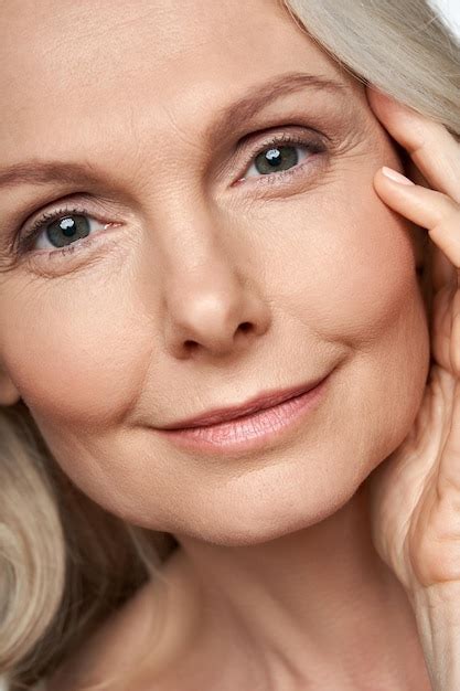 premium photo 50 years old woman looking at camera anti age skin care face close up view