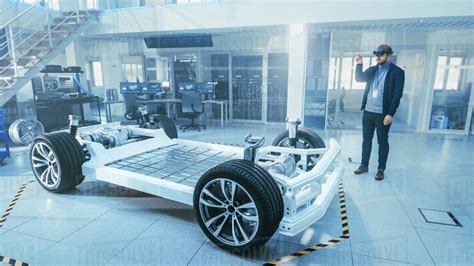 Automotive Engineer Working On Electric Car Chassis Platform Using