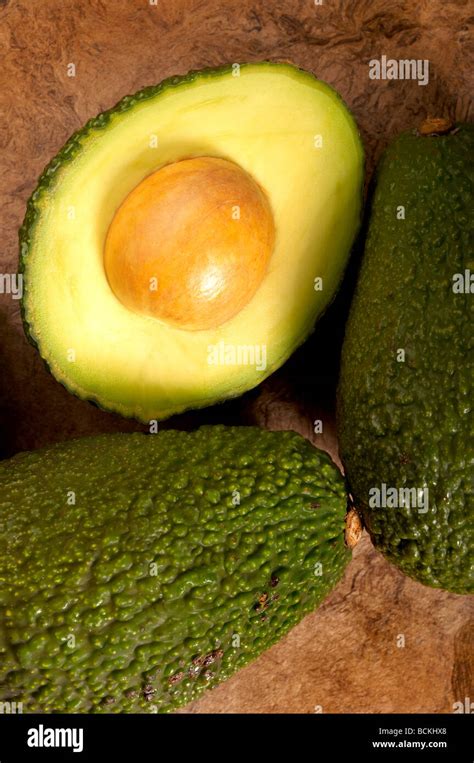Avocados On Textured Background Stock Photo Alamy
