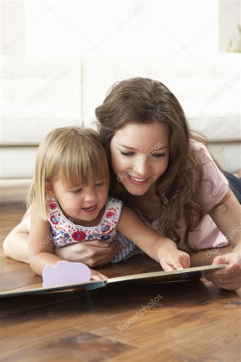 Mother And Daughter Learning To Read At Home Stock Photo By
