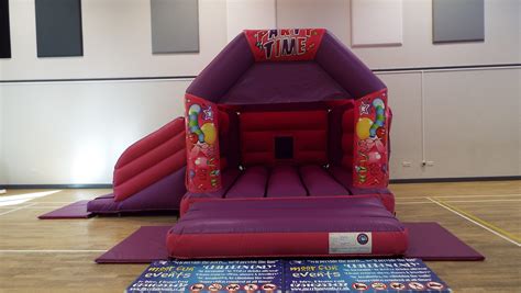Pink And Purple Side Slide Castle Velcro 15 X 17ft Bouncy Castle Hire