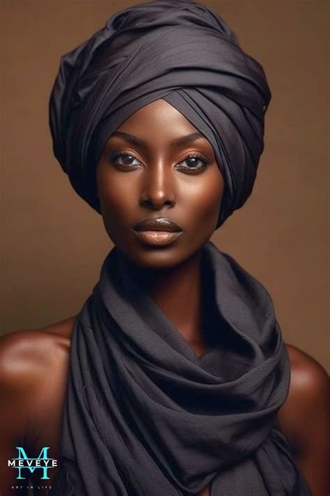 An African Woman Wearing A Black Turban And Posing For A Photo In Front