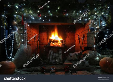 Close Up Decorated Christmas Fireplace With Lights At Night Stock Photo