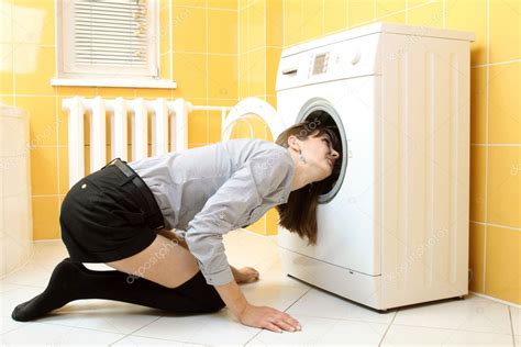 Ordinary Simple Beautiful Girl Put Her Head Into A Washing Machine Stock Photo Rumisphoto