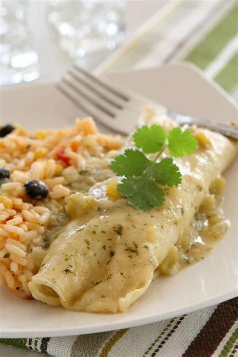 Little nubs of sweet corn and black beans fill each spoonful, along with tender bits of shredded chicken. chicken enchiladas sour cream recipe. Creamy Chicken ...