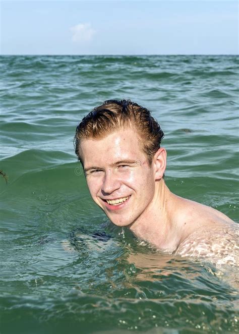Teenage Boy Enjoys Swimming In The Ocean Stock Photo Image Of Hair