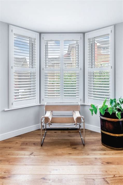 I have arched windows like yours on the front of my house and have plantation shutters that include the arch and open in the middle. Living Room & Lounge Shutters | Interior Shutters ...