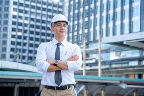 Successful Male Architect At A City With Arms Crossed Stock Photo