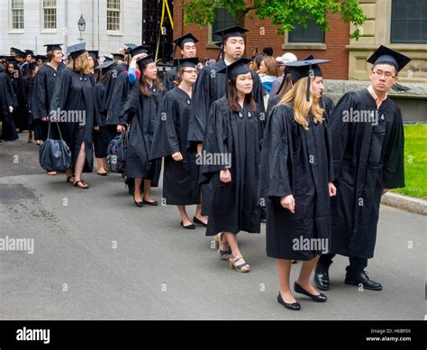 Wearing Graduation Caps And Gowns Multiracial Harvard University