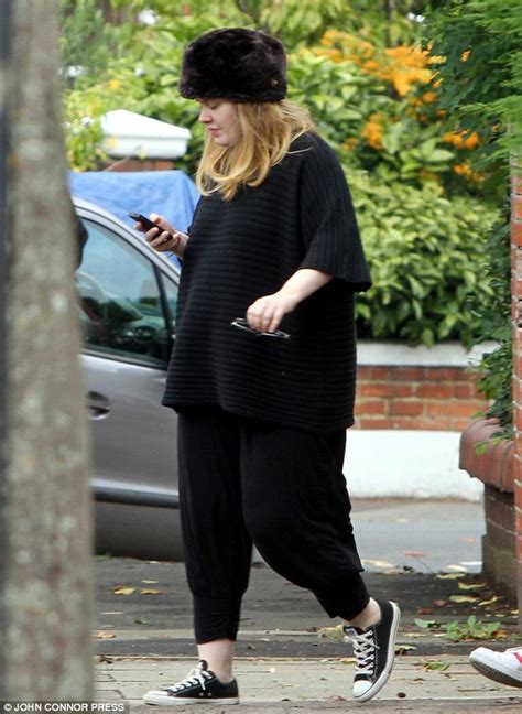 A Heavily Pregnant Adele Sticks To Her Favourite Colour Black As She
