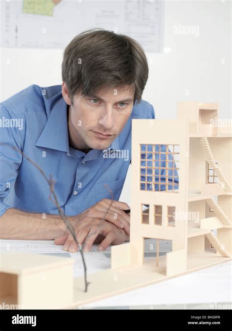 An Architect Examining An Architectural Model Stock Photo Alamy
