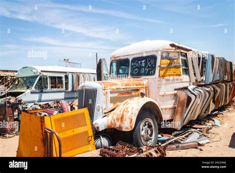 Abandoned Rusty Buses In A Junk Yard In The Desert Near Phoenix Arizona
