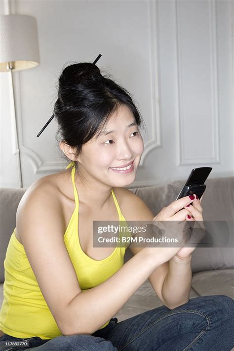 Woman Using Phone High Res Stock Photo Getty Images