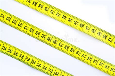 Yellow Measuring Tape Or Centimeter Isolated On White Background Stock