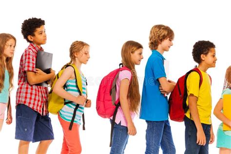 School Kids Go In Line With Backpacks Profile View Stock Image Image