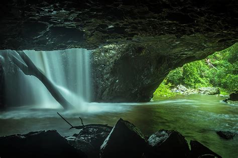 Water Cascading Through The Ceiling Of The Natural Bridge In